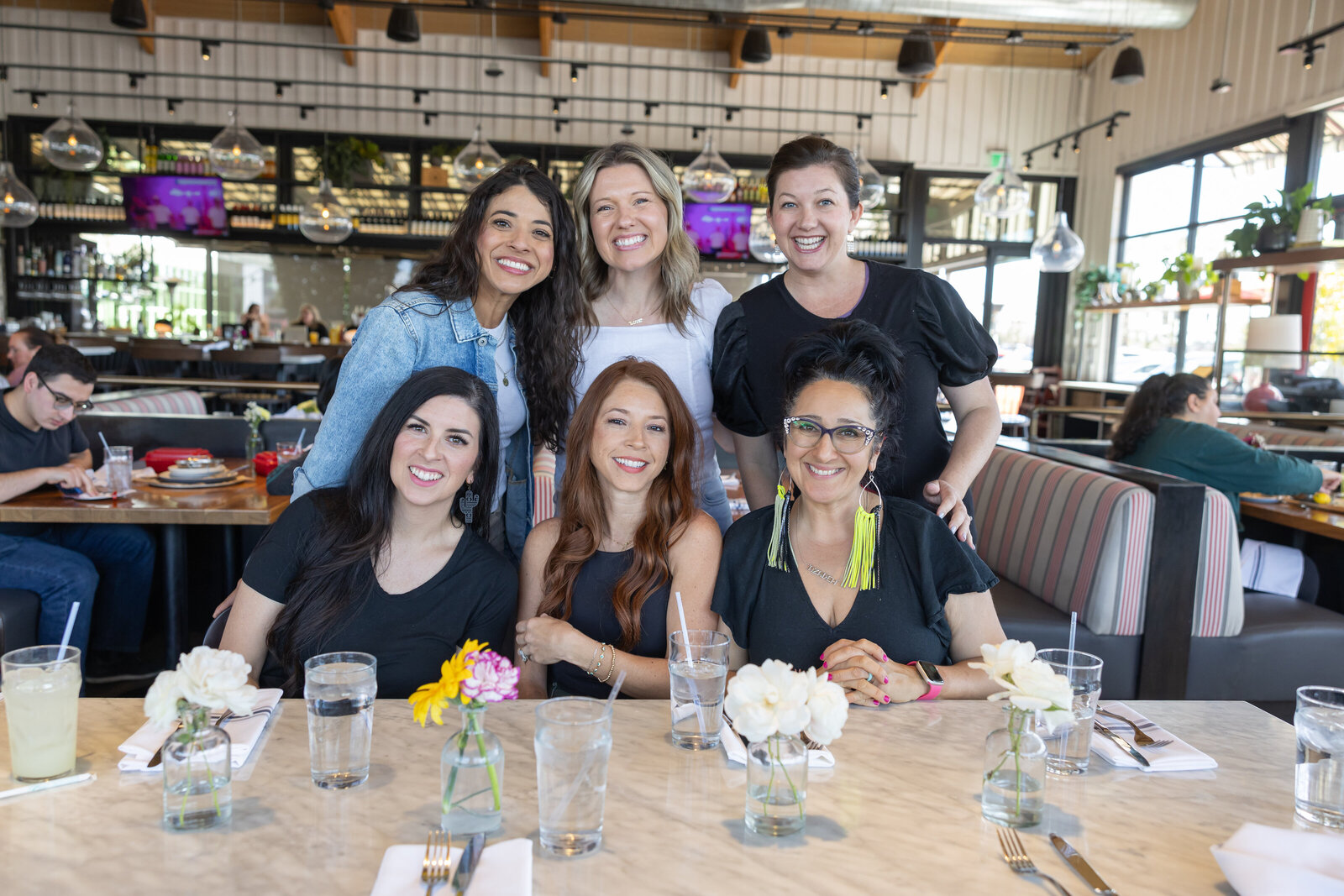 Women gathered around a lunch table at a Connect Belong event